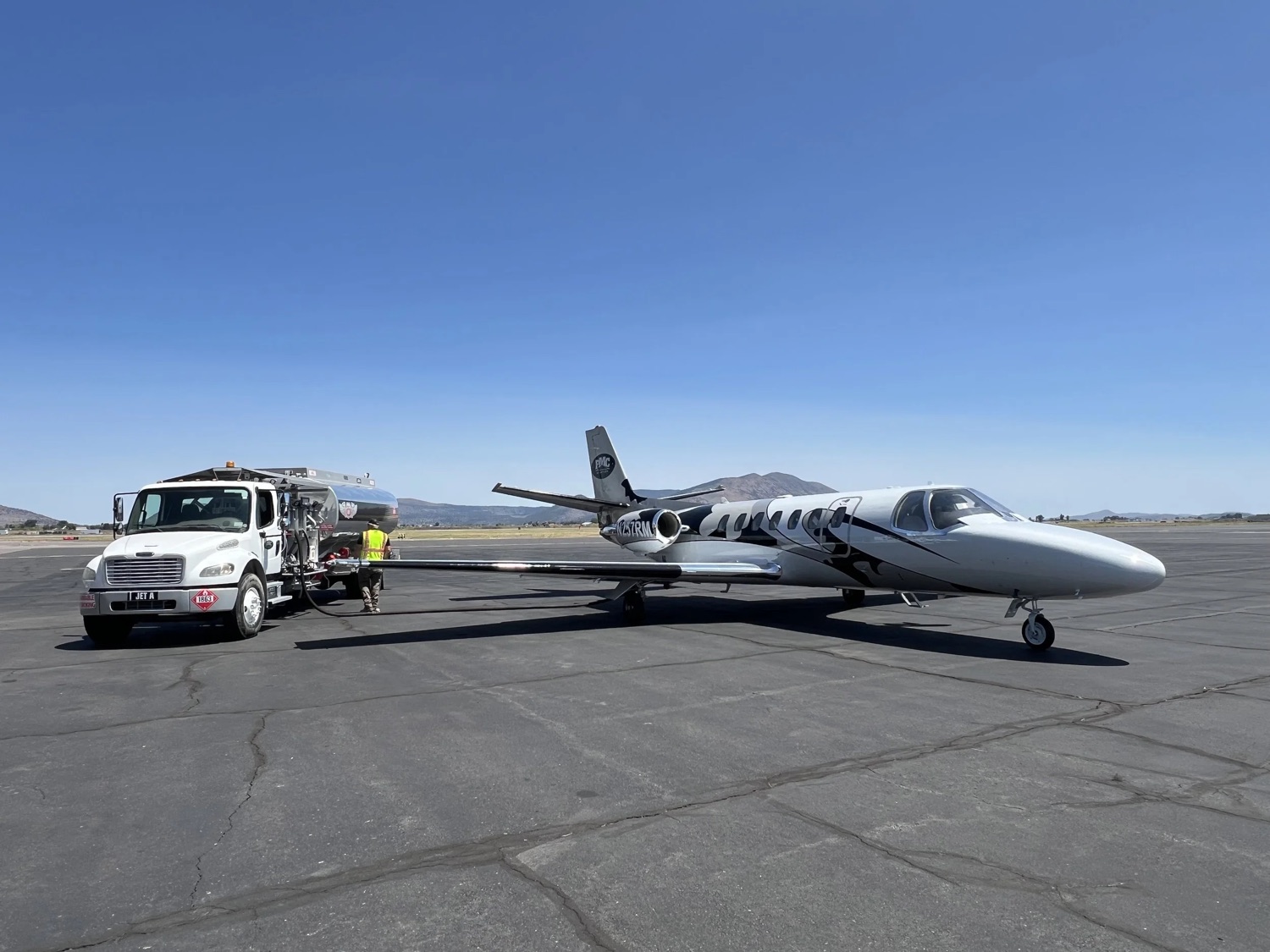 RMC Aviation fuel truck refueling a business jet on the ramp at Crater Lake-Klamath Regional Airport